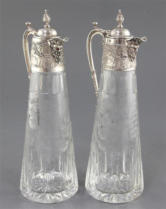 A pair of 1980s silver mounted etched glass claret jugs by C.J. Vander Ltd, 31cm